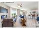 Open-concept living area seamlessly connects to the kitchen, featuring wood-look floors and a cozy fireplace at 107 Rustling Waters Dr, Mooresville, NC 28117