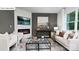 This living room features a fireplace, gray accent wall, and modern decor at 116 Rustling Waters Dr, Mooresville, NC 28117