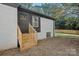 Side view of house with wooden steps leading to back door at 1600 Academy St, Charlotte, NC 28205