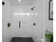 Large walk-in shower with geometric tile and glass enclosure at 1600 Academy St, Charlotte, NC 28205