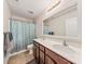 Bathroom with double sinks and large mirror at 5703 Eleanor Rigby Rd, Charlotte, NC 28278