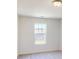 Bright bedroom features a large window with view of the outside at 4057 Lawnview Dr, Charlotte, NC 28269