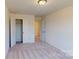 Cozy bedroom with plush carpet and a spacious closet at 4057 Lawnview Dr, Charlotte, NC 28269