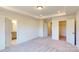 Spacious bedroom with carpet, multiple doors, and recessed lighting at 4057 Lawnview Dr, Charlotte, NC 28269