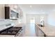 Modern kitchen features an island, granite countertops, subway tile backsplash, and stainless appliances at 4057 Lawnview Dr, Charlotte, NC 28269