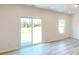 Bright living room with sliding glass doors leading to the outdoors and light wood floors at 4057 Lawnview Dr, Charlotte, NC 28269