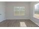Simple bedroom with hardwood floors and large windows at 1209 Red River Dr, Salisbury, NC 28144