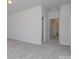 Spacious bedroom with plush carpeting and an adjacent hallway to bathroom at 1209 Red River Dr, Salisbury, NC 28144