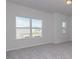 Bright bedroom with carpet and large windows overlooking the neighborhood at 1209 Red River Dr, Salisbury, NC 28144