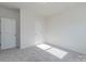 Simple bedroom with neutral walls and grey carpeting at 1209 Red River Dr, Salisbury, NC 28144