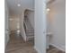 A view of an entryway with a staircase and powder room at 1209 Red River Dr, Salisbury, NC 28144