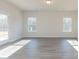 Spacious Gathering room with hardwood floors and access to the backyard at 1209 Red River Dr, Salisbury, NC 28144