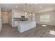 Modern kitchen with white cabinets, granite countertops, and an island at 1209 Red River Dr, Salisbury, NC 28144