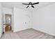 Bedroom with neutral carpet, ceiling fan, and adjoining doorways at 2059 Parks Rd, Salisbury, NC 28147