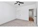 Cozy bedroom with plush carpeting, white walls, and an open doorway to an adjacent room at 2059 Parks Rd, Salisbury, NC 28147