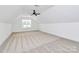 Spacious bedroom with a ceiling fan and a large window providing ample natural light at 2059 Parks Rd, Salisbury, NC 28147