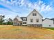 Inviting two-story home with stone accents, white siding, wood shutters, and manicured lawn at 2059 Parks Rd, Salisbury, NC 28147