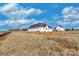 New home under construction features white siding and black roof, set against a blue sky at 2059 Parks Rd, Salisbury, NC 28147