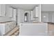 Bright kitchen with white cabinets and island, ready for personalization at 2059 Parks Rd, Salisbury, NC 28147