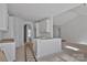 Unfinished kitchen features white cabinetry, bare floors and uninstalled appliances at 2059 Parks Rd, Salisbury, NC 28147