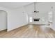 Bright living room boasts a fireplace, ceiling fan, vaulted ceiling, and light wood floors at 2059 Parks Rd, Salisbury, NC 28147
