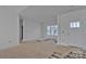 Bare room with fresh white paint, awaiting finishing, ladder lying on ground at 2059 Parks Rd, Salisbury, NC 28147