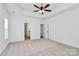 Large bedroom with carpeted flooring and a ceiling fan, offering a comfortable retreat at 2059 Parks Rd, Salisbury, NC 28147