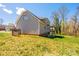 The backyard of this home features a large lawn with a deck and covered area at 2640 Ironwood Dr, Hickory, NC 28602