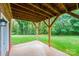 The covered patio features stained wood beams and concrete flooring, perfect for outdoor gatherings at 2640 Ironwood Dr, Hickory, NC 28602
