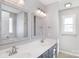 Well-lit bathroom with double sinks, framed mirrors, and modern fixtures at 217 Dewars Dr, Rock Hill, SC 29730