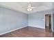 Spacious bedroom featuring hardwood floors, fan, and plenty of natural light at 217 Dewars Dr, Rock Hill, SC 29730