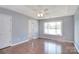 Spacious bedroom with hardwood floors, large window, and ceiling fan at 217 Dewars Dr, Rock Hill, SC 29730