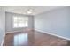 Open bedroom with hardwood floors, natural light, and neutral wall color at 217 Dewars Dr, Rock Hill, SC 29730