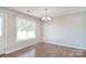 Dining area featuring hardwood floors, a chandelier, and a large window at 217 Dewars Dr, Rock Hill, SC 29730