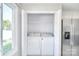 Convenient laundry closet with a washer and dryer next to a stainless steel refrigerator at 217 Dewars Dr, Rock Hill, SC 29730