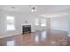 Spacious living room featuring hardwood floors, a fireplace, and natural light at 217 Dewars Dr, Rock Hill, SC 29730
