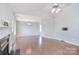 Open living area with hardwood floors, fireplace, and neutral wall color at 217 Dewars Dr, Rock Hill, SC 29730