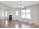 Open-plan living area with hardwood floors, fireplace, and plenty of light at 217 Dewars Dr, Rock Hill, SC 29730