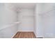 Bright walk-in closet with white wire shelving and modern flooring at 217 Dewars Dr, Rock Hill, SC 29730