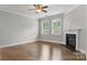 Spacious living room with hardwood floors, fireplace, and large windows at 3735 Norman View Dr, Sherrills Ford, NC 28673