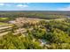 Expansive aerial shot of a property, including the house, pool and factory in a picturesque landscape at 5960/5930 S Main St, Salisbury, NC 28147