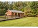 Brick home with ramp and lush greenery in a well-maintained backyard at 5960/5930 S Main St, Salisbury, NC 28147