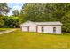 Exterior shot of a detached garage with white siding and green grass at 5960/5930 S Main St, Salisbury, NC 28147