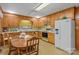 Retro-style kitchen with wooden cabinets and a dining table at 5960/5930 S Main St, Salisbury, NC 28147