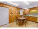 Charming kitchen with wood paneled walls, an eating area, and classic cabinetry at 5960/5930 S Main St, Salisbury, NC 28147