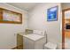 Well-lit laundry room includes washer, dryer, and window at 5960/5930 S Main St, Salisbury, NC 28147