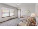 Cozy living room with gray carpet, neutral walls, and natural light at 5960/5930 S Main St, Salisbury, NC 28147