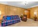 Spacious living room with comfortable seating, wood paneling, and traditional decor at 5960/5930 S Main St, Salisbury, NC 28147