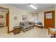 Cozy living room with floral sofa, wood trim, and a traditional aesthetic at 5960/5930 S Main St, Salisbury, NC 28147