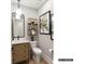 Modern bathroom with floating vanity, unique shelving, and a decorative mirror at 8115 Farm Crossing Ln # 3, Huntersville, NC 28078